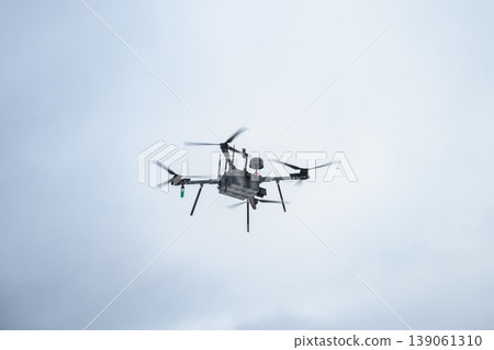 Military bomber drone flying in cloudy sky Military bomber drone flying in cloudy sky 139061310