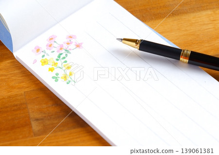 Letter - The image of writing a letter on a notepad. Letter - The image of writing a letter on a notepad. 139061381