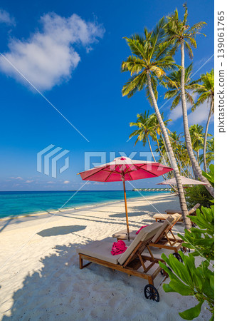 Dreamy romantic beach sunbeds umbrellas honeymoon couple love sunny summer destination palm trees ocean view tourism background paradise vertical tropical landscape Dreamy romantic beach sunbeds umbrellas honeymoon couple love sunny summer destination palm trees ocean view tourism background paradise vertical tropical landscape 139061765