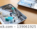 Used syringes and IV tubes placed on a tray - Image of medical waste 139061925