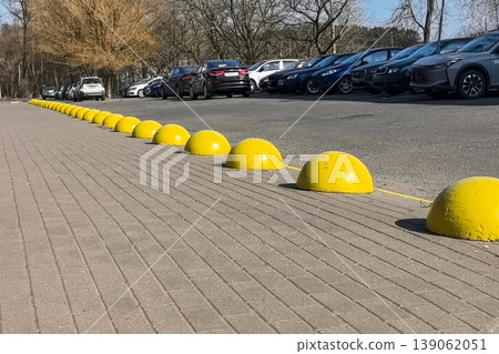Yellow Parking Barriers on Sidewalk 139062051