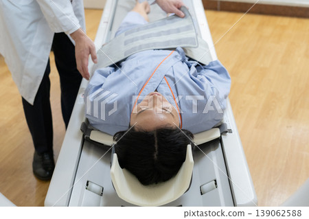 Patient undergoing a CT scan at a hospital. Photography cooperation: Denpa Gakuen Educational Foundation, Tokyo Electronics College. Patient undergoing a CT scan at a hospital. Photography cooperation: Denpa Gakuen Educational Foundation, Tokyo Electronics College. 139062588