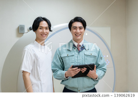 Engineers and doctors maintaining a hospital's CT scanner. Photo courtesy of Denpa Gakuen Educational Foundation, Tokyo Electronics College. Engineers and doctors maintaining a hospital's CT scanner. Photo courtesy of Denpa Gakuen Educational Foundation, Tokyo Electronics College. 139062619