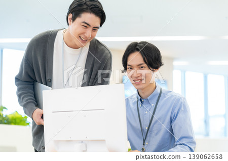 Engineers holding a meeting in the office. Filming assistance provided by: Denpa Gakuen Educational Foundation, Tokyo Electronics College. Engineers holding a meeting in the office. Filming assistance provided by: Denpa Gakuen Educational Foundation, Tokyo Electronics College. 139062658