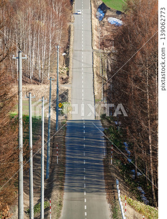 The new roller coaster road in Asahikawa, Hokkaido in early spring 139062773