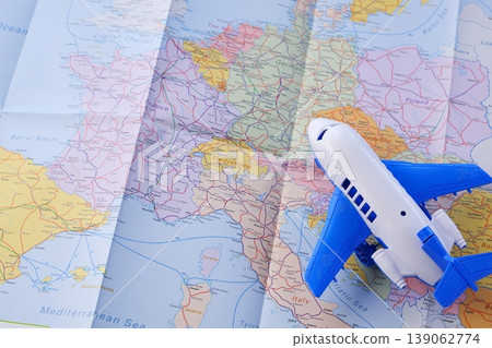 European Travel - An image of a passenger plane flying over Europe, representing an air journey to Europe. European Travel - An image of a passenger plane flying over Europe, representing an air journey to Europe. 139062774