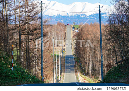 The new roller coaster road in Asahikawa, Hokkaido in early spring The new roller coaster road in Asahikawa, Hokkaido in early spring 139062785