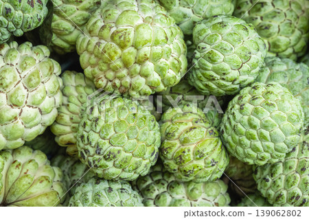 Custard apples for sale at the market, tropical sweet and nutritious fruits Custard apples for sale at the market, tropical sweet and nutritious fruits 139062802