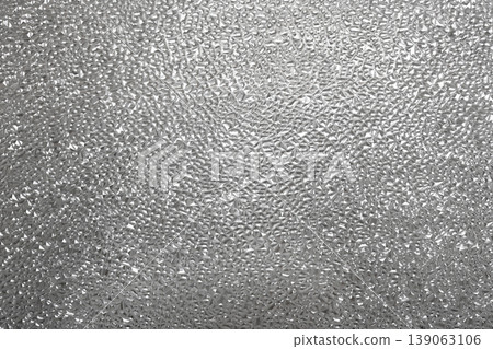 The uneven, opaque surface of patterned glass scatters light. The uneven, opaque surface of patterned glass scatters light. 139063106