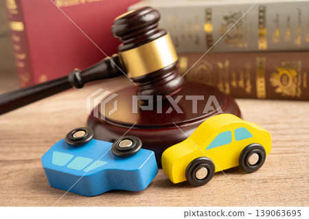 Car accident lawsuit and insurance, Judge hammer with car model. Car accident lawsuit and insurance, Judge hammer with car model. 139063695