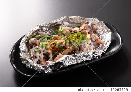 Squid tentacles grilled with mayonnaise and shichimi spice. Squid tentacles grilled with mayonnaise and shichimi spice. 139063729