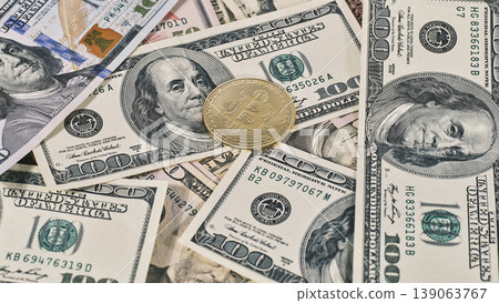 Bitcoin on american dollar banknote close up Bitcoin on american dollar banknote close up 139063767