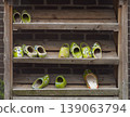 Painted Old Dutch Wooden Clogs on Weathered Rustic Shelf 139063794