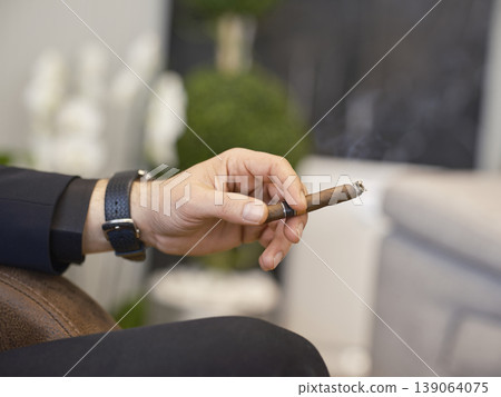 a man smoking a cuban cigar a man smoking a cuban cigar 139064075