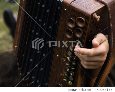 hands playing alpine bavarian accordion 139064157