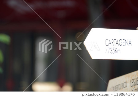 Cartagena Long distance street arrow sing Cartagena Long distance street arrow sing 139064170