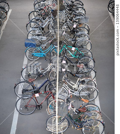 Many bicycles parked in the bicycle parking area Many bicycles parked in the bicycle parking area 139064448