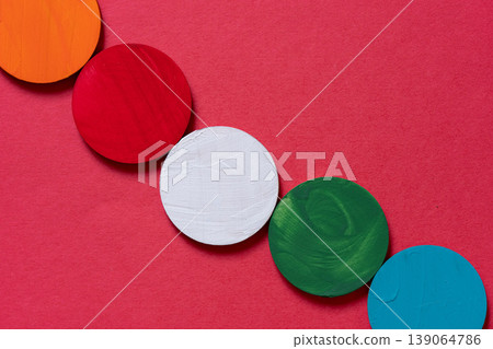 Colorful round ornaments against a red background 139064786