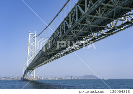 Viewing the Akashi Kaikyo Bridge from below on the Awaji Island side. Viewing the Akashi Kaikyo Bridge from below on the Awaji Island side. 139064818