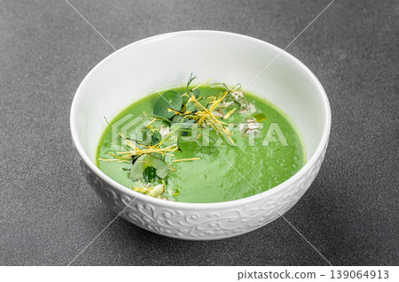 Green detox cream soup with microgreens healthy vegan puree minimal food styling 139064913