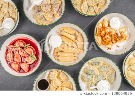 vareniki dumplings set flat lay different types on plates food background vareniki dumplings set flat lay different types on plates food background 139064939