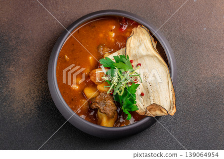 Meat stew with potatoes in bowl top view 139064954