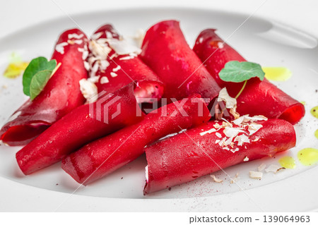 Beetroot rolls with feta cheese healthy vegetarian appetizer on white plate close up 139064963