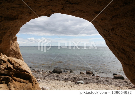 View from cliffed coast and a cave in Tuno island, Denmark View from cliffed coast and a cave in Tuno island, Denmark 139064982