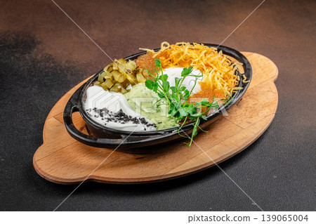 salad appetizer with caviar potato sauce pickles restaurant dish 139065004