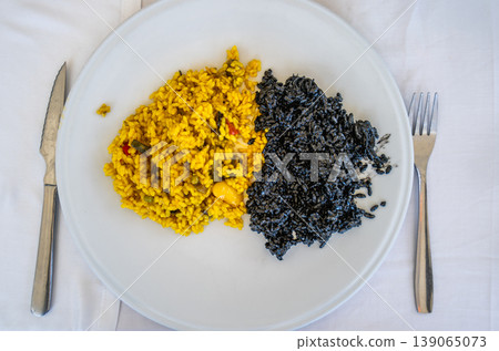 Traditional Paella and Black Squid Ink Rice in Valencia Spain 139065073