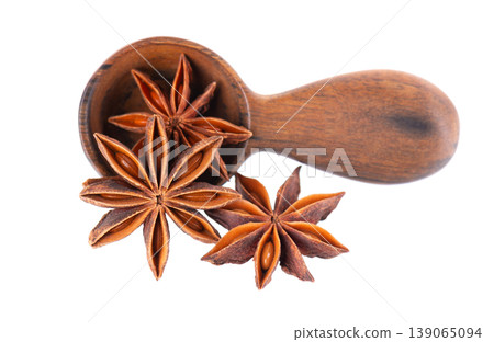 Star anise isolated on white background. Anise stars or badian spice in wooden spoon. Clipping path. Star anise isolated on white background. Anise stars or badian spice in wooden spoon. Clipping path. 139065094