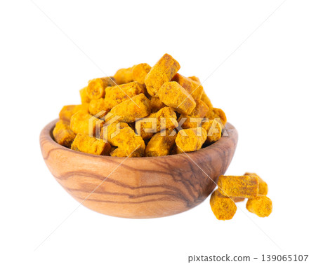 Bee bread isolated on white background. Pile of granules bee bread or perga in wooden bowl. Clipping path. Bee bread isolated on white background. Pile of granules bee bread or perga in wooden bowl. Clipping path. 139065107