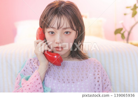 A woman making a phone call A woman making a phone call 139065936