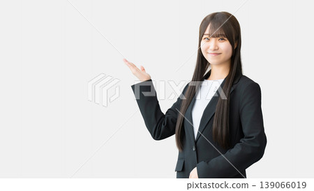 A young woman/businesswoman guiding with her hands. 139066019