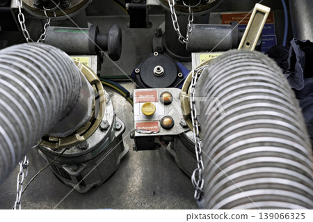 Close-up of the manifold control panel and fuel handling hose. Close-up of the manifold control panel and fuel handling hose. 139066325