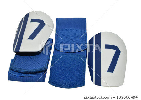 Football shin guards with protective pads and Velcro straps 139066494