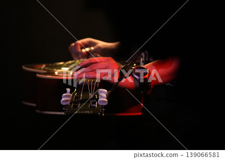 Guitar playing on stage live concert instrument detail Guitar playing on stage live concert instrument detail 139066581