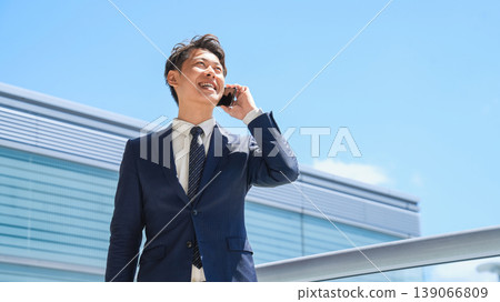 Male businessman talking on a smartphone Male businessman talking on a smartphone 139066809