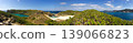 A wide-angle panoramic view of the southern island of the Ogasawara Islands, featuring Fan Pond and the stunning Bonin Blue waters. 139066823