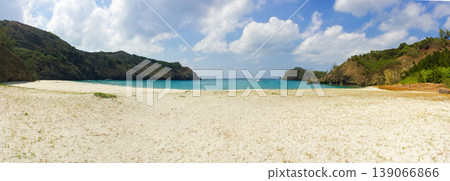 Kominato Beach on Chichijima Island in the Ogasawara Islands: White sandy beach and emerald green panorama. Kominato Beach on Chichijima Island in the Ogasawara Islands: White sandy beach and emerald green panorama. 139066866