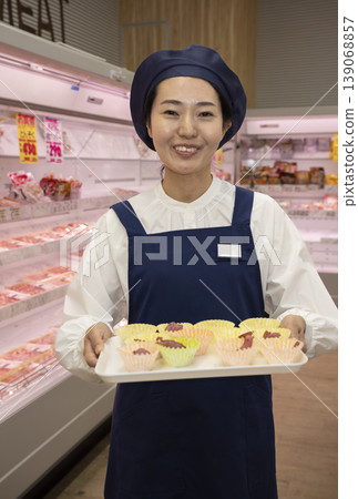 Staff conducting food sampling and sales Staff conducting food sampling and sales 139068857