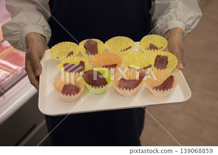 Staff conducting food sampling and sales Staff conducting food sampling and sales 139068859