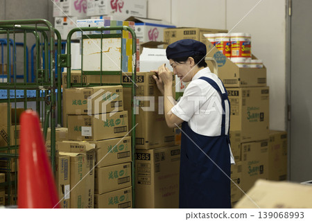 A part-time female worker cries alone in the back room. A part-time female worker cries alone in the back room. 139068993