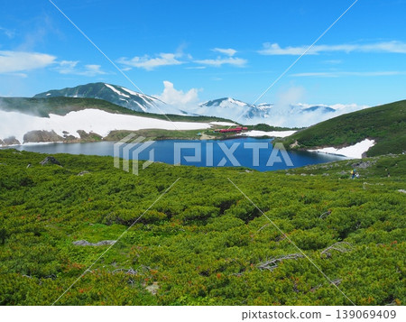 Snow-capped Mt. Yukikura and Mt. Asahi as seen from Hakuba Oike in summer. Snow-capped Mt. Yukikura and Mt. Asahi as seen from Hakuba Oike in summer. 139069409