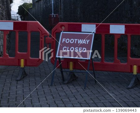 Fenced off walkway with footway closed warning sign Fenced off walkway with footway closed warning sign 139069443