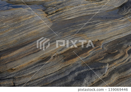 Layered rock formations along Scottish coastline texture background Layered rock formations along Scottish coastline texture background 139069446