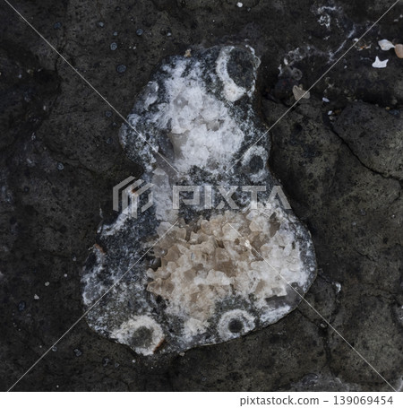 Rock formation featuring quartz geode with mineral crystals Rock formation featuring quartz geode with mineral crystals 139069454
