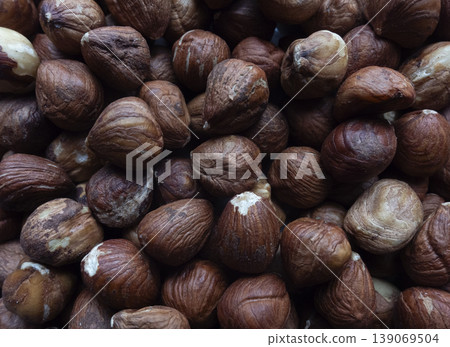 Hazelnuts background. Close up of hazelnut texture Hazelnuts background. Close up of hazelnut texture 139069504