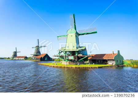 Windmills and traditional houses in Zaanse Schans, Netherlands Windmills and traditional houses in Zaanse Schans, Netherlands 139070236