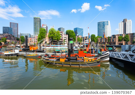 Wijnhaven harbor with historic tugboats in Rotterdam Netherlands Wijnhaven harbor with historic tugboats in Rotterdam Netherlands 139070367
